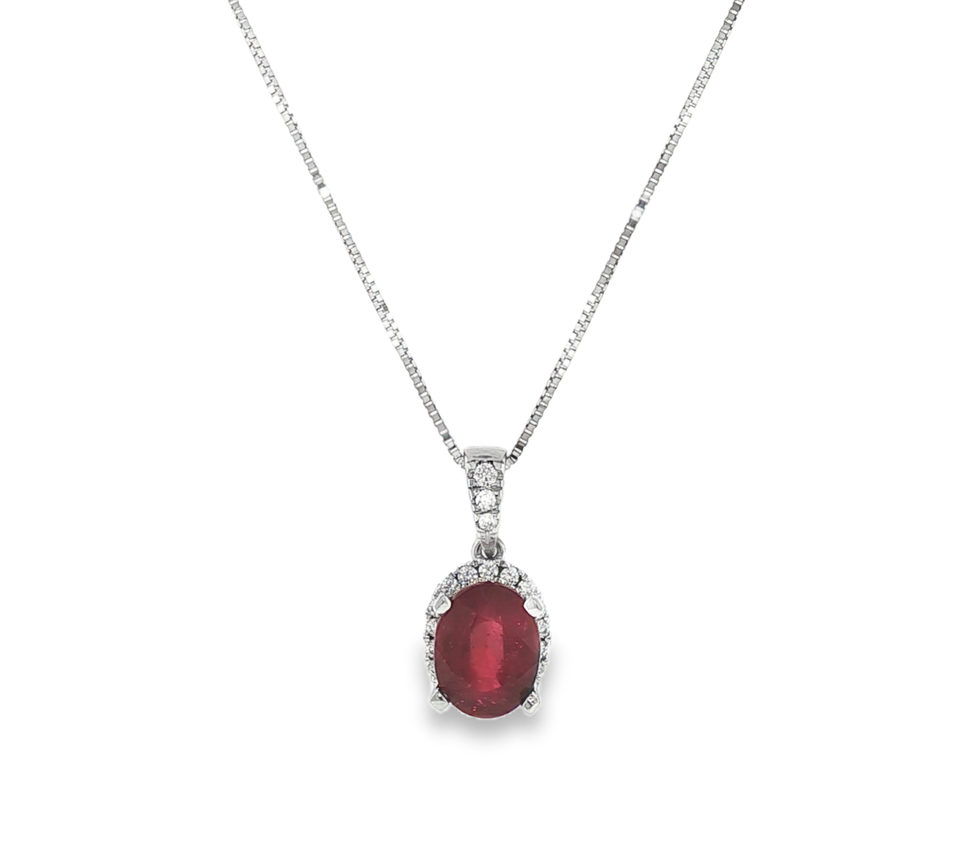 Ruby and diamond halo pendant in 18k white gold