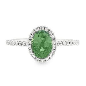 Oval green sapphire halo ring with diamond band in 18k white gold