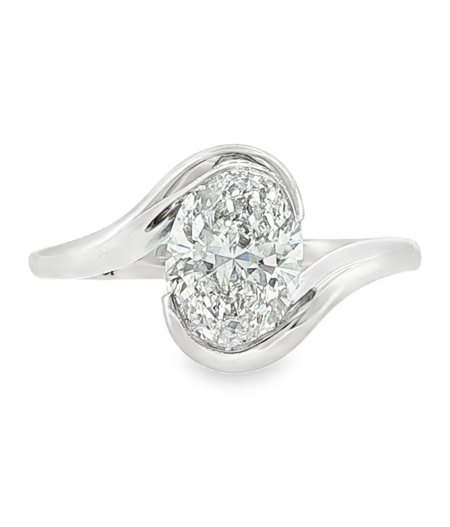 Swirl solitaire engagement ring with oval lab grown diamond in 18k white gold