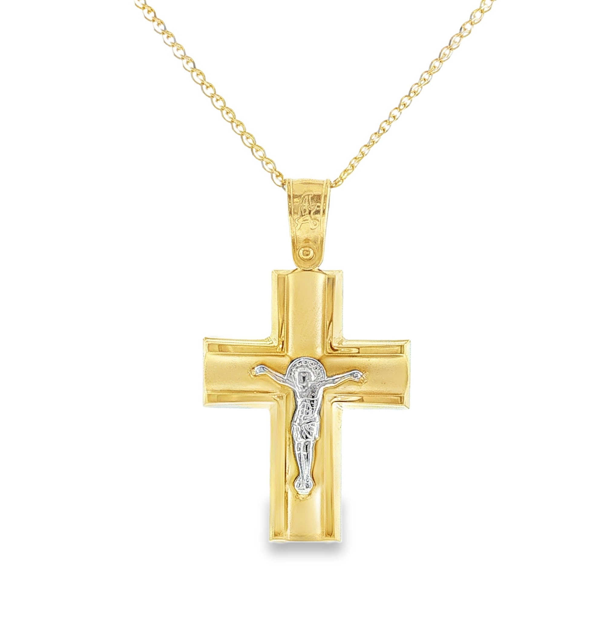 Elegant 14K yellow gold cross featuring a white gold figure of Christ and a polished finish. A timeless religious pendant with classic craftsmanship, perfect for everyday wear or gifting.