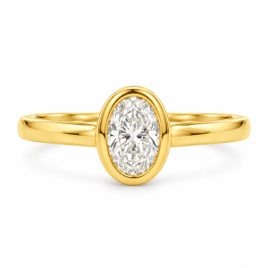18K yellow gold engagement ring featuring an oval natural diamond in a sleek bezel design, paired with a polished band for a clean, modern finish.